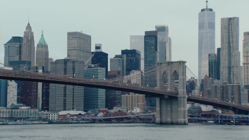 Panorama of a modern city on the edge of a sea canal with a long bridge