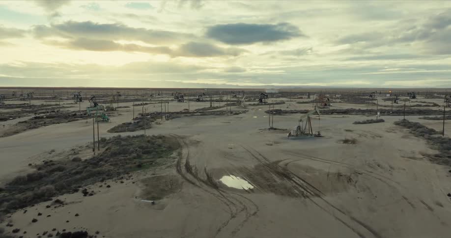 Aerial view of oil rigs operating in a desert area