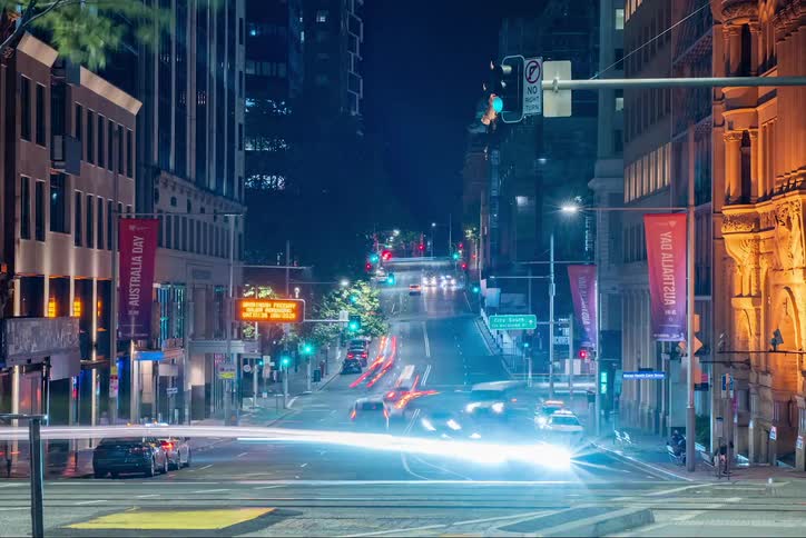 Urban road at night with vehicle traffic