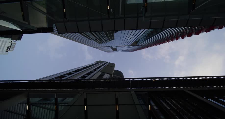 Clouds hang high over tall skycrapers