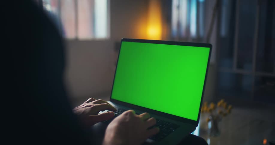 Persons hand opening a laptop and starting to type