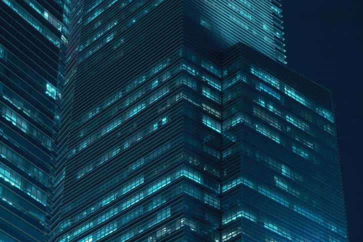 The lights on the different floors of the building flicker rapidly at night