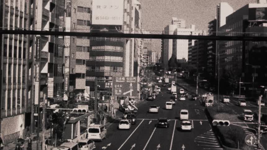 Traffic goes up the road in the city
