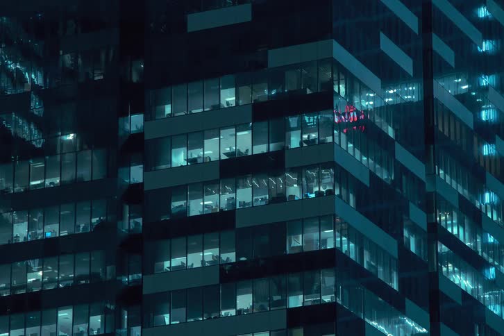 People move around the office turning the lights on and off