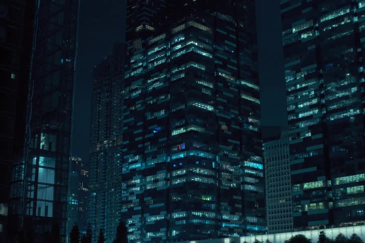 Lights flicker before turning off in city skyscrapers