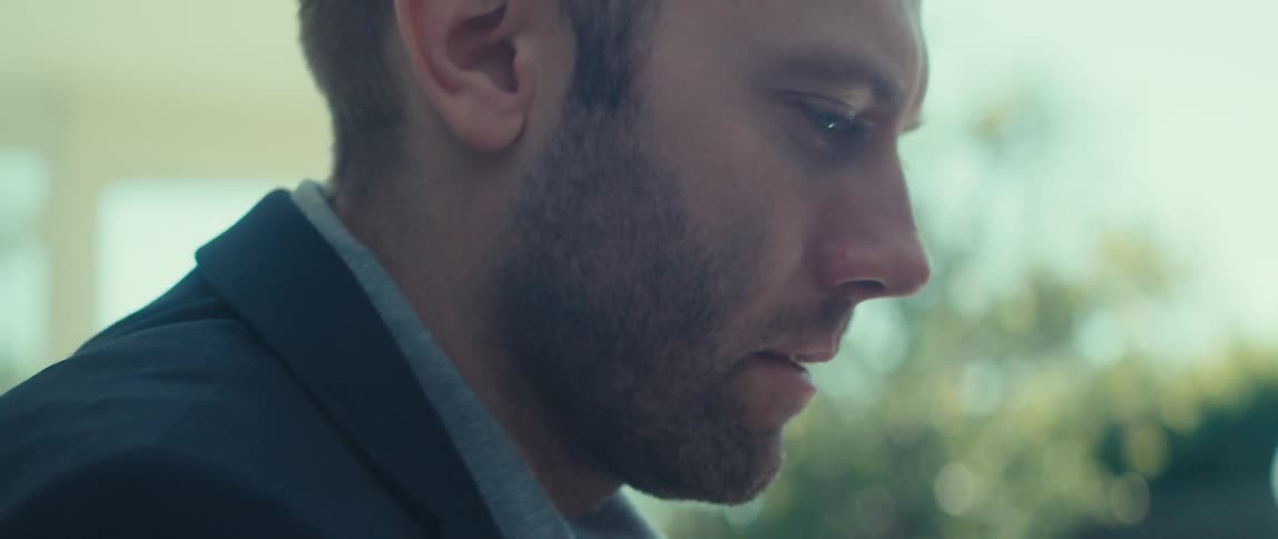 Closeup of businessman focusing on work while outside