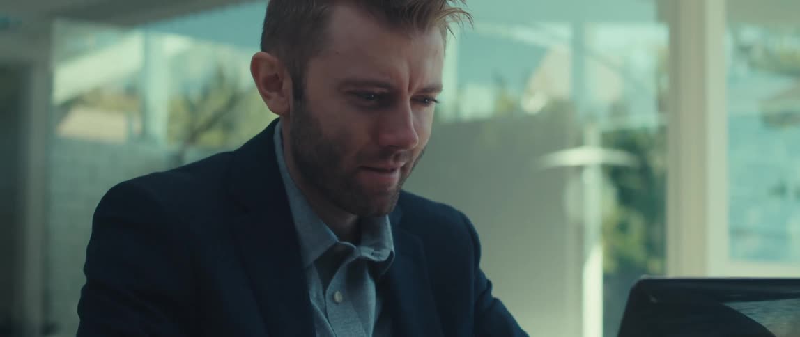 A clip of an office worker operating a laptop
