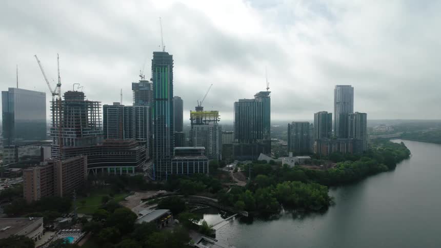 Aerial view of a metropolis with skyscrapers built on the banks of a sea canal