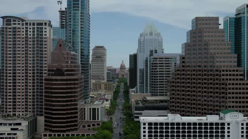 Aerial view of buildings and skyscrapers in a metropolis seen during the day
