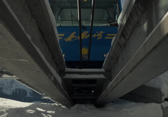 Train climbing the track on a snowy mountain