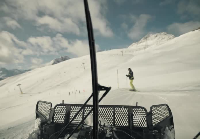 People are skiing down the white slope