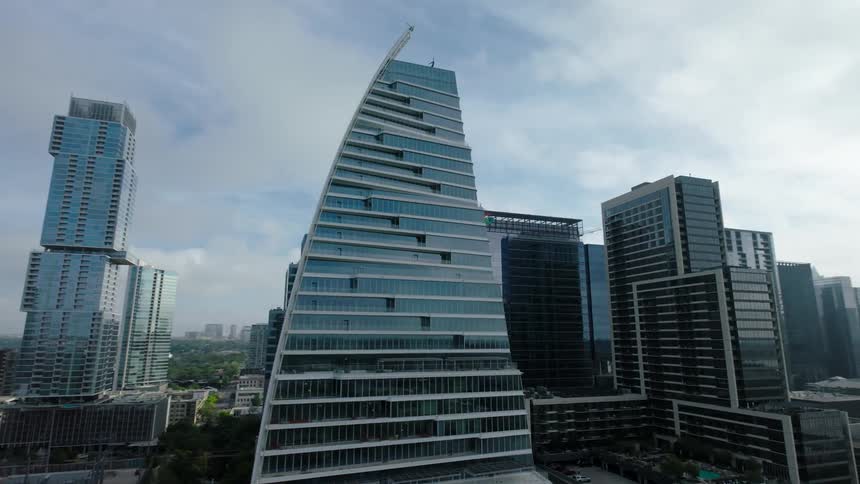 Aerial view of a tower block including a skyscraper with a curved side