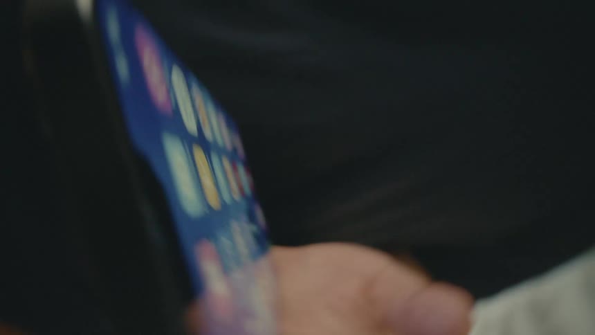 A clip of a person pressing a smartphone