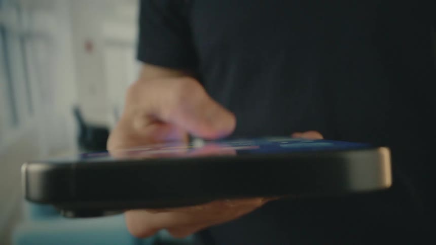 A footage of a person holding an iphone