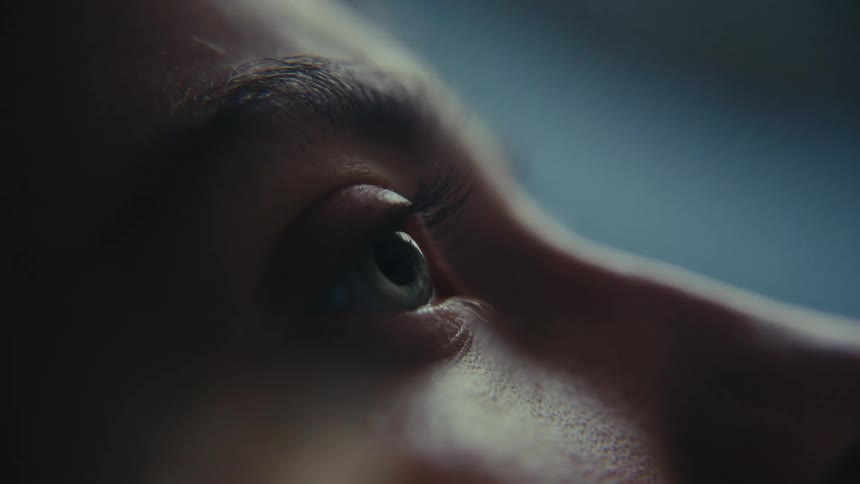 Detail shot of a woman looking at something