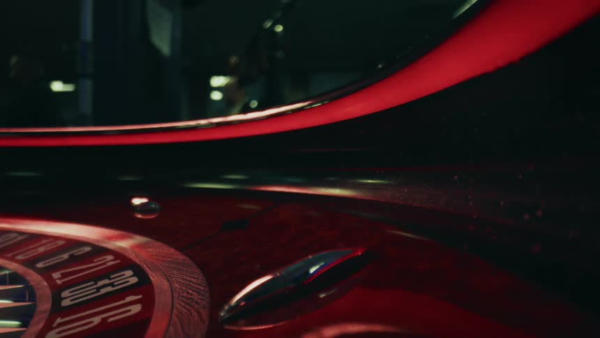 A ball rolls around the roulette table