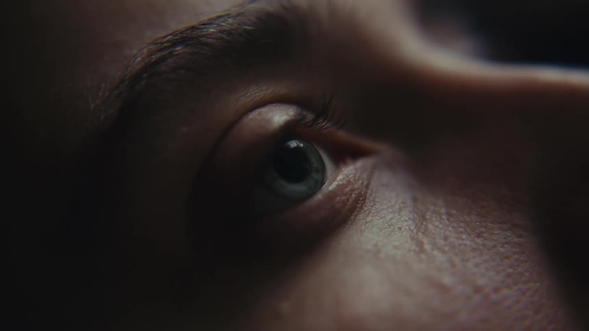 A persons eye subtly shifts with a slight movement