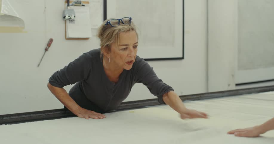 Two women working on a fabric