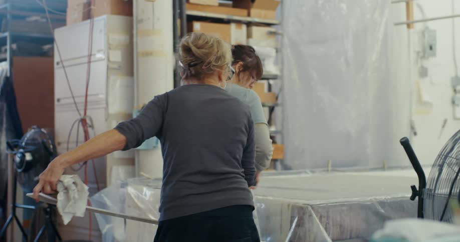 Two women are working in the warehouse
