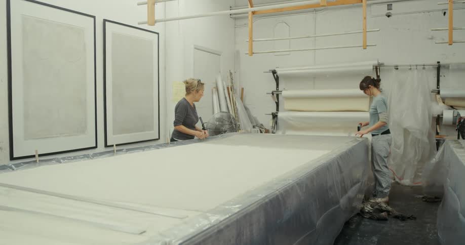 Two women working in a textile factory