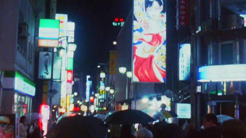 The path in the city is full of people walking at night