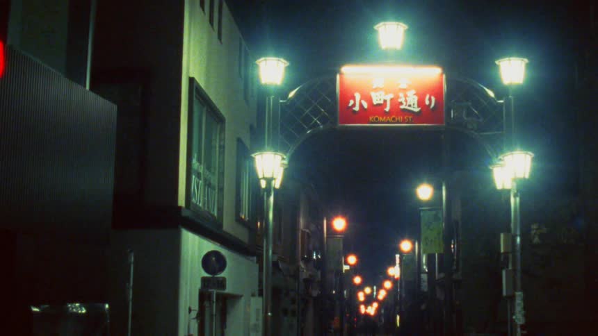 Urban corridor seen at night with lights on