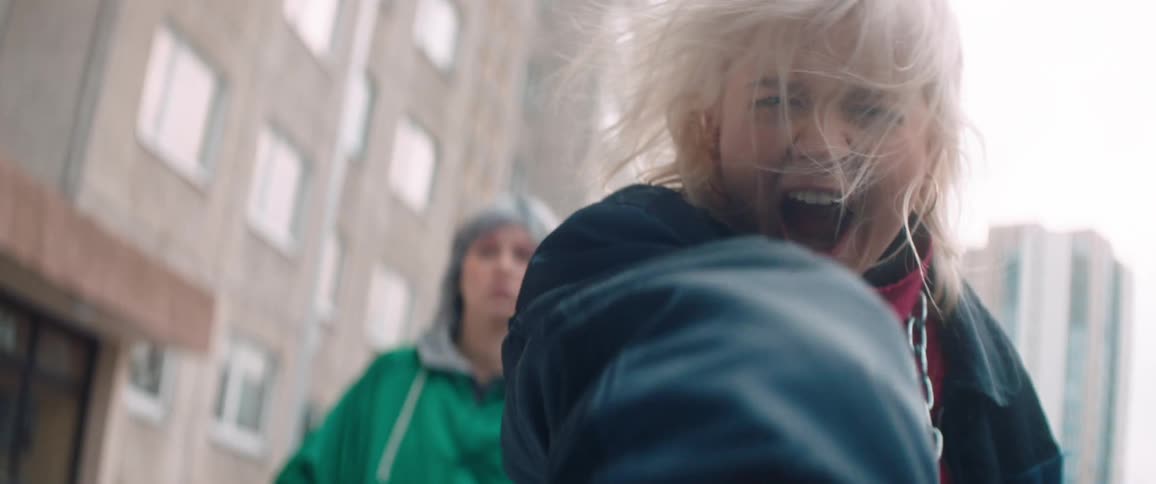 A woman screams and reaches her hand out