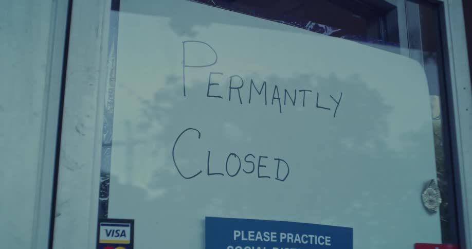A sign is displayed on the door that states the store is closed for good