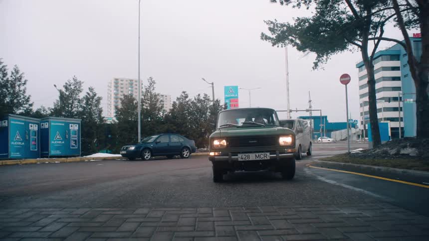 A clip of a car riding into a gas station