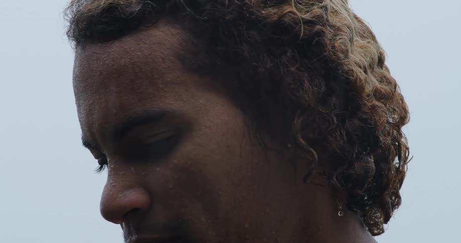 A man deep in thought looks around