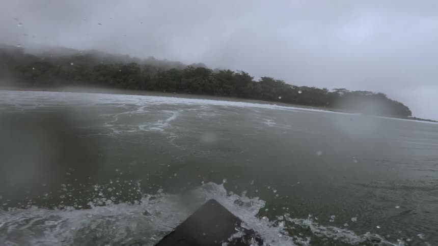 Point of view from a surfboard in the ocean