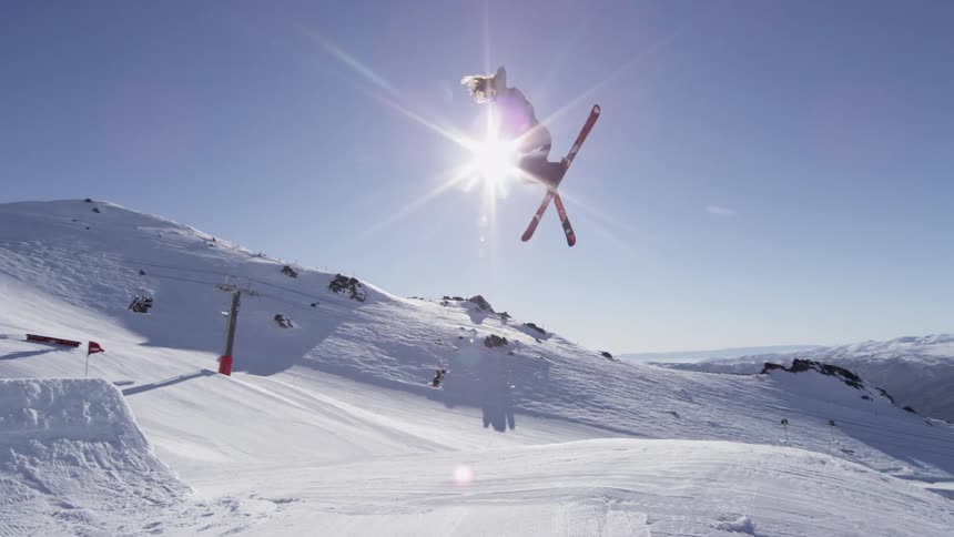 Person doing a high jump on a sunny day
