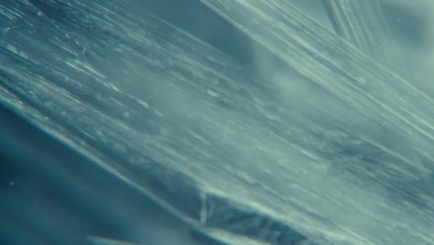 Extreme close up of a crack of ice condensed in water