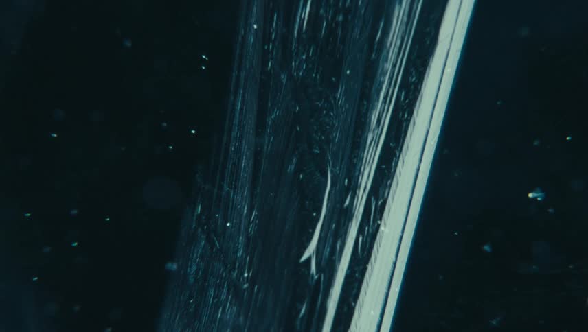 Freezing ice texture with fine lines and scattered particles
