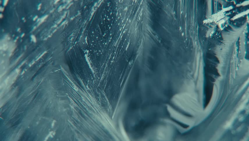A closeup view of intricate ice crystal formations with detailed sharp lines and textures