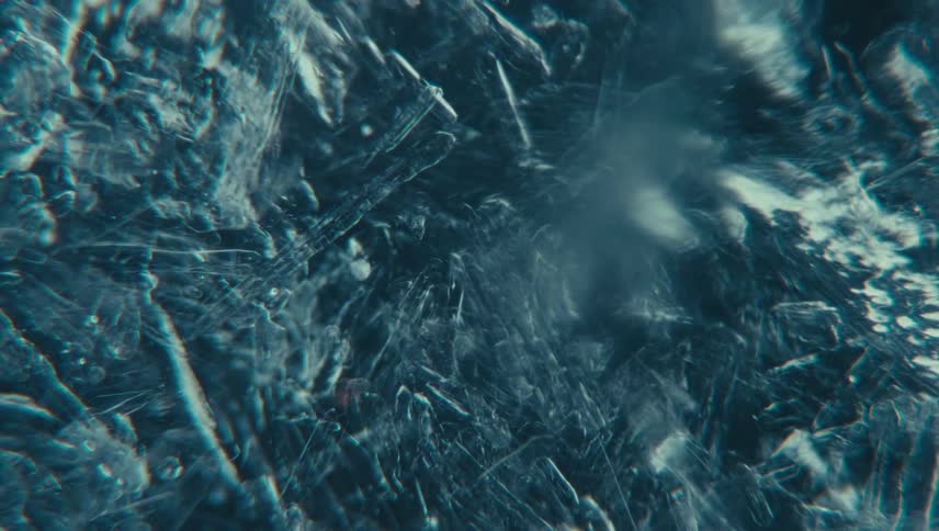 An icy textured surface with intricate frost patterns