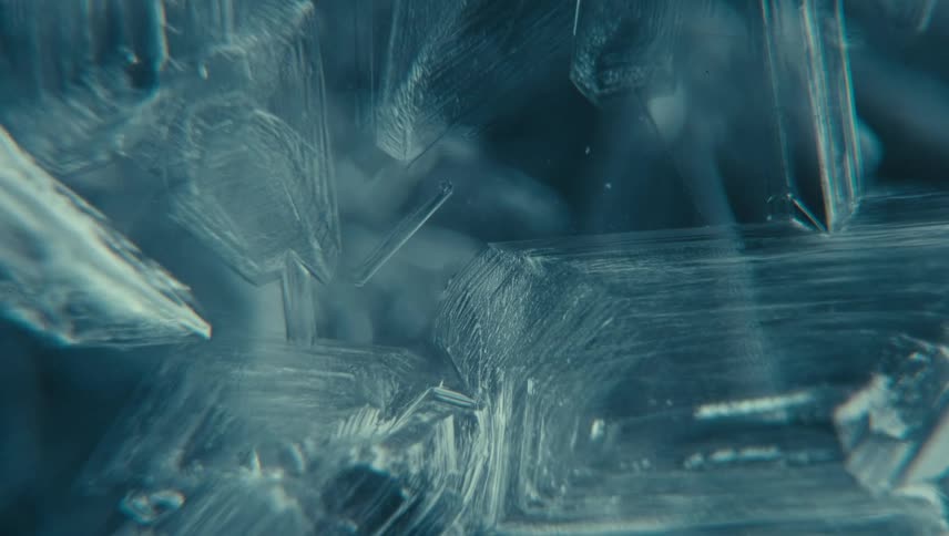 Ice crystals grow on a surface in a time lapse that shows their progression