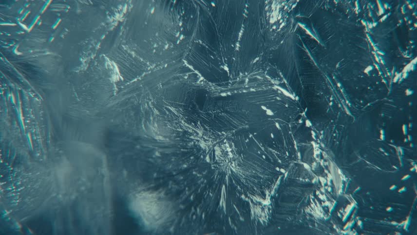 A crystalline structure with a deep blue hue characterized by a textured surface with visible lines and patterns
