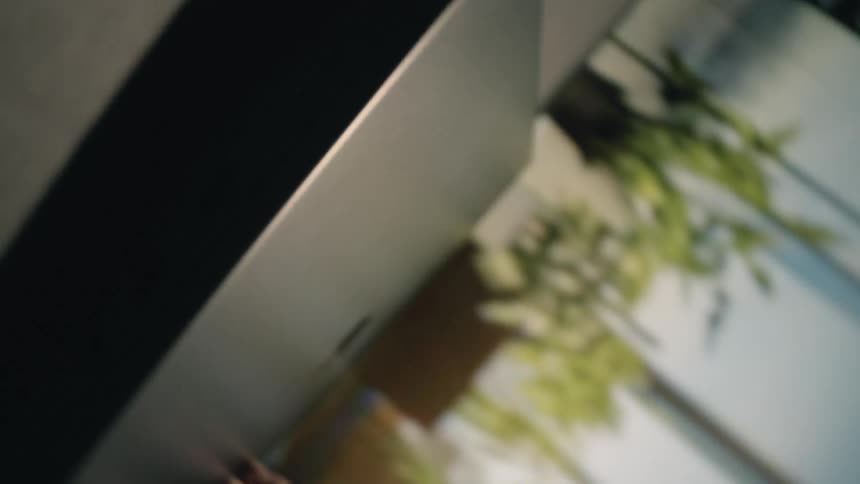 Man hits a key on a keyboard then closes his laptop