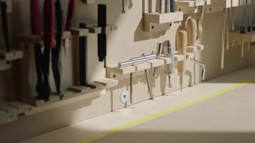 Tools are hung neatly on a workbench
