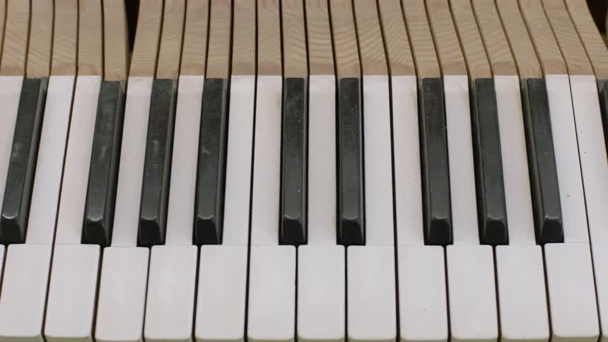 The keys of a piano are exposed