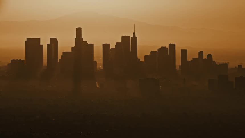 Thick smog looks orange as it hovers over a city