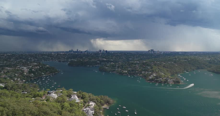 Large clouds are pouring rain in the distance