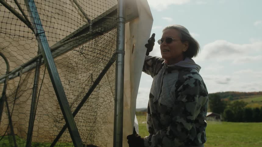 A clip of a lady standing beside a barricade