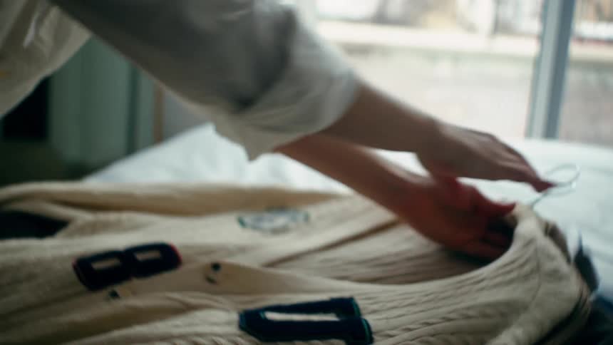 Clothing is placed on the bed