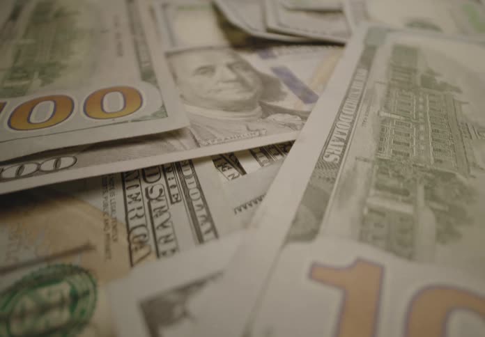 Money bills over a surface indoors