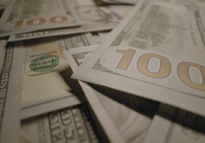 Many many hundred dollar bills