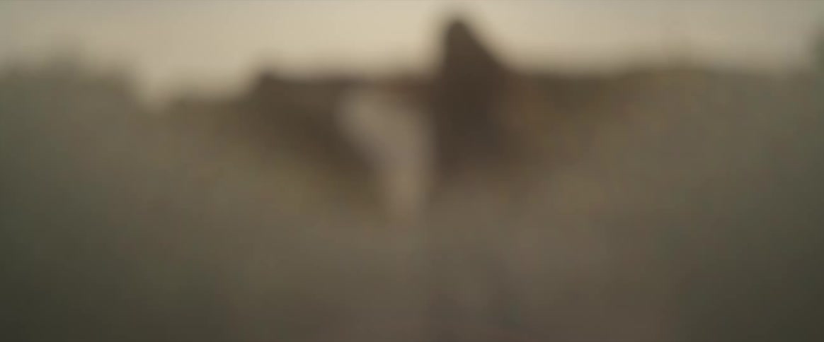 A woman is dancing around in the haze