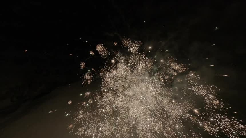 The fire works fill the night sky