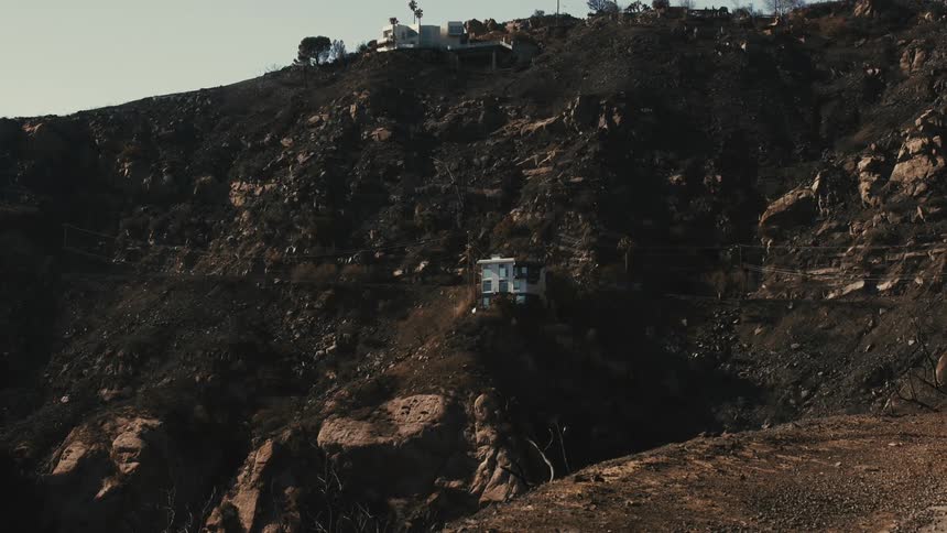 A home is at the top of the hill